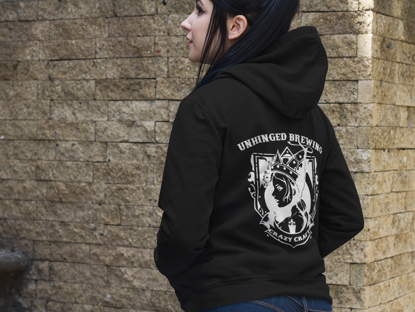 Woman wearing an Unhinged Brewing Hoodie